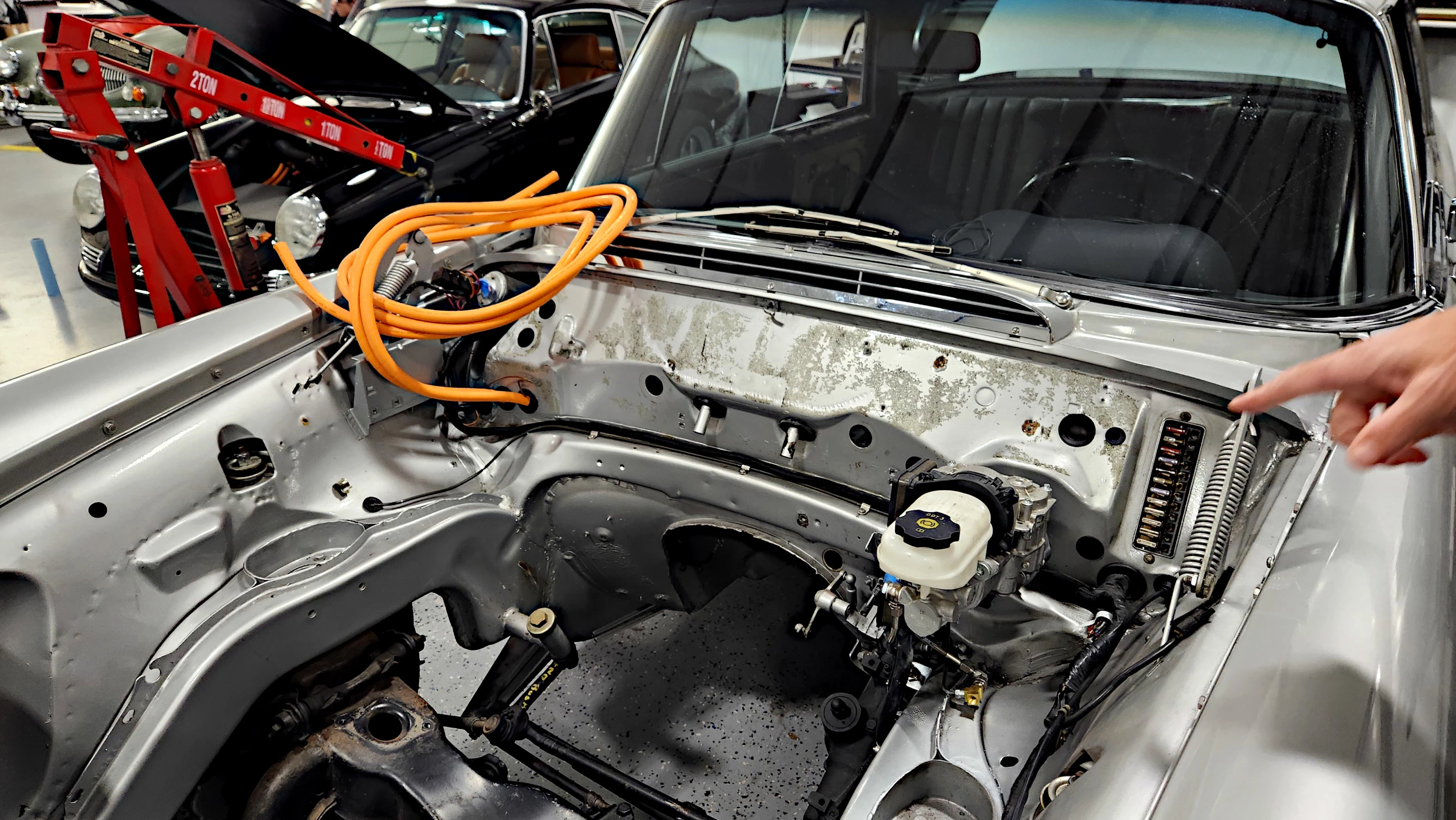 A "De-ICEd" Mercedes-Benz coupe awaiting a 3D scan and having had wiring, brake, and power steering conversion
