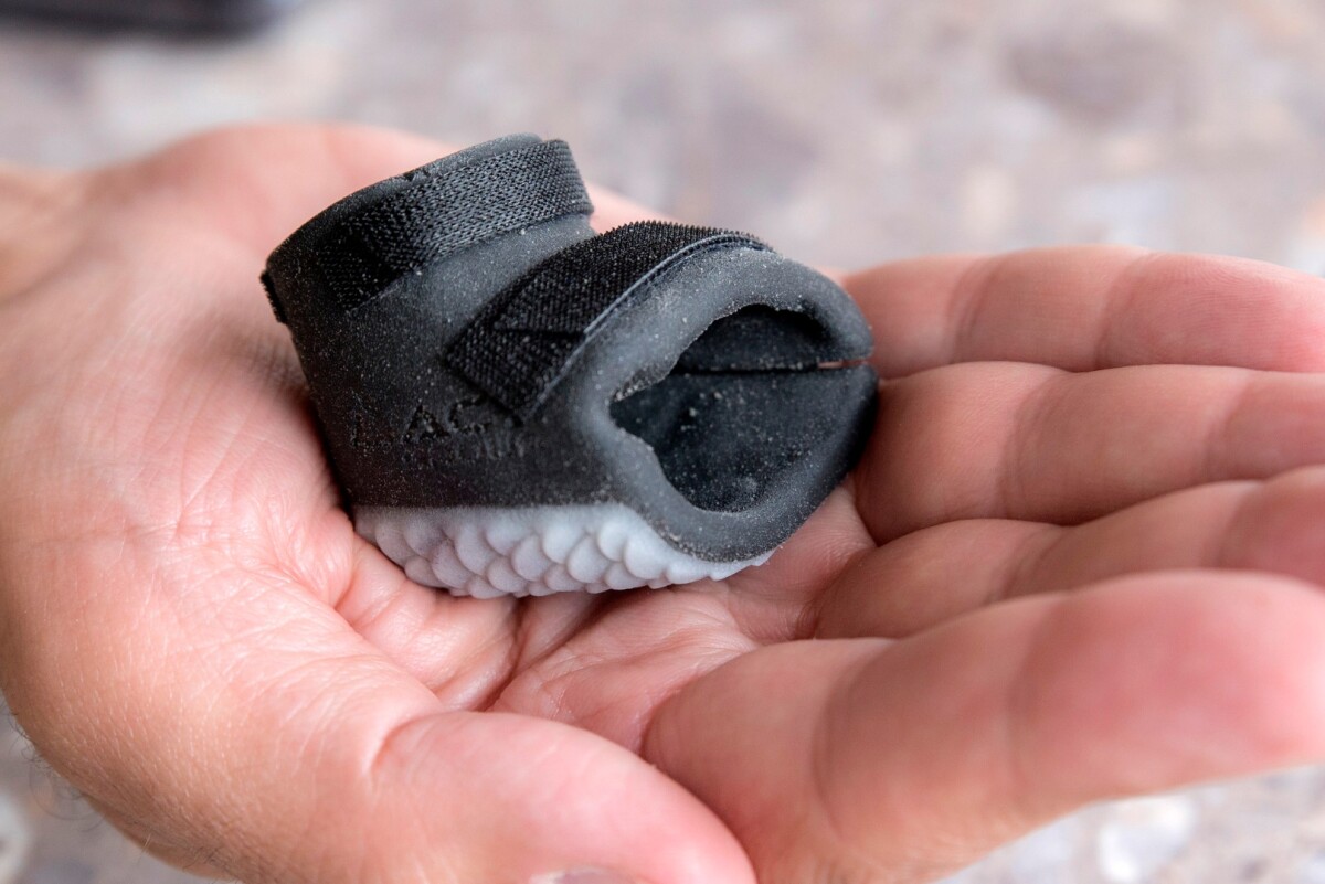 The printed boot is lighter, more durable, a better fit and has Purps walking and swimming as well as his penguin pals