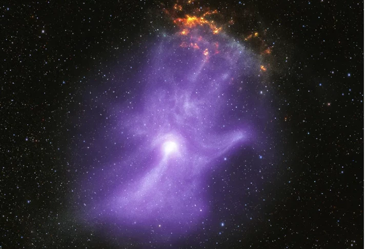 The ghostly four-fingered hand, with charged particles forming the 'bone' structure of the nebula