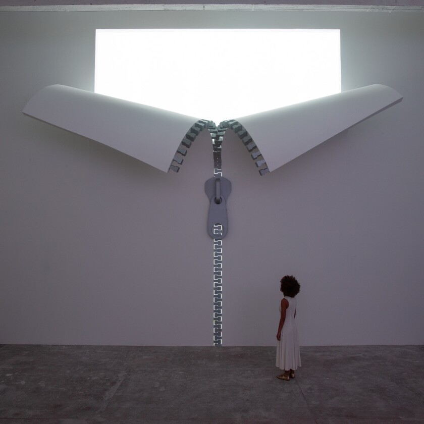 The interior of IQOS World includes another zip installation on the wall