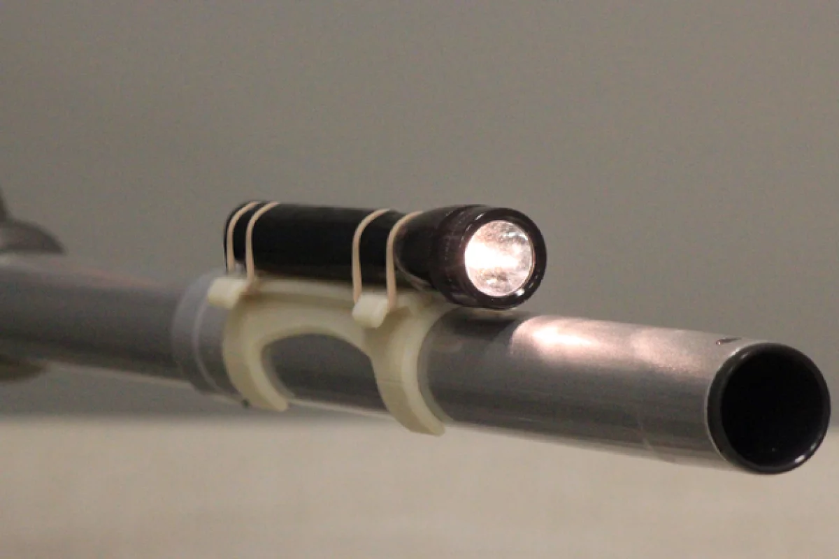 A 3D-printed flashlight mount is one of two printable designs released by Hoover