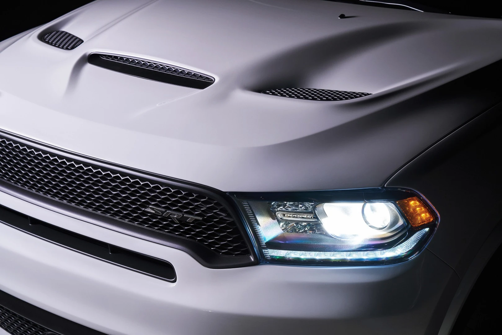 The SRT hood helps in cooling the engine, increasing performance