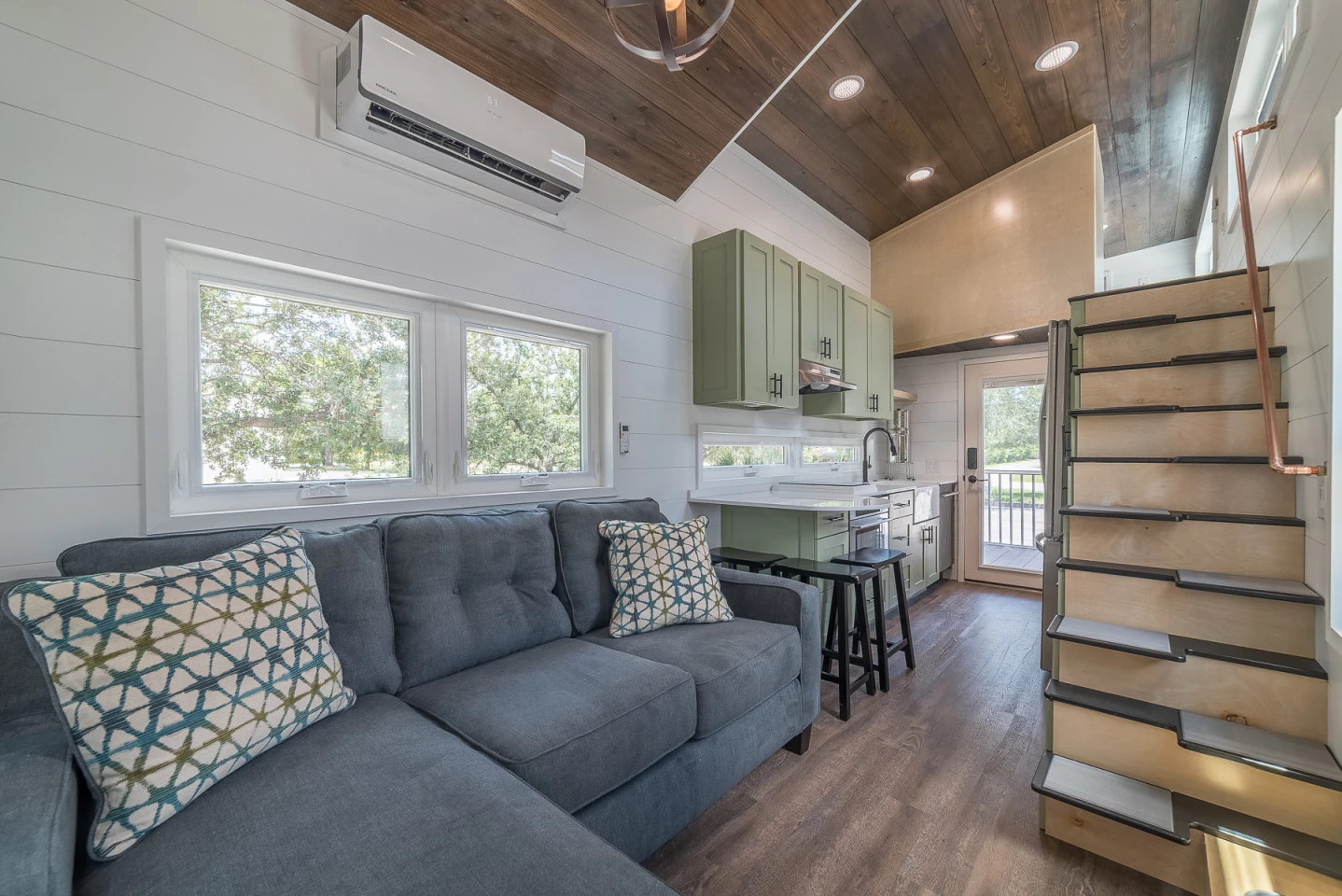 The livingroom might not be huge, but it looks quite cozy. The mini-split is sure to keep your area at whatever ideal temperature you want