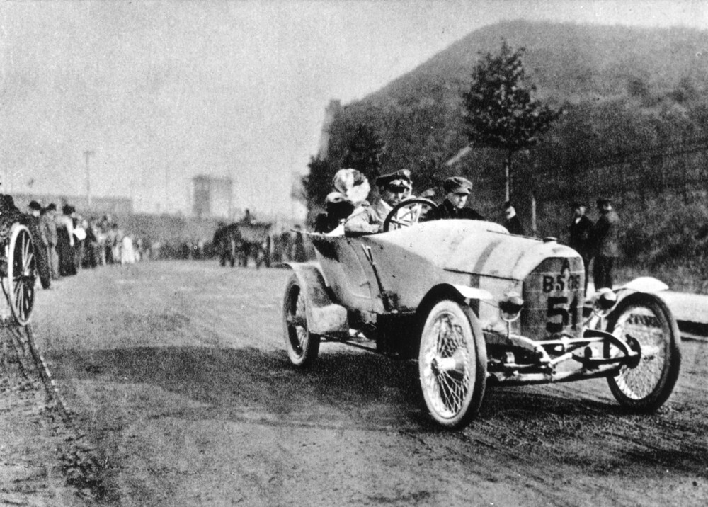 The Austro-Daimler Prinz Heinrich is often referred to as the world's first sports car. It was built by Austro-Daimler, an Austrian subsidiary of the German DMG (Daimler-Motoren-Gesellschaft) which merged with Benz to become Mercedes-Benz 15 years later). The car was designed by Ferdinand Porsche and made a 1-2-3 clean sweep of the 1910 German Alpine "Prinz Heinrich Trial." The trial was named after the auto enthusiast younger brother of Kaiser Wilhelm II of Germany, and was a contest for four-seat passenger cars. Ferdinand Porsche actually drove the winning car in the trial (above), and the model was named after the trial, just as many replica cars after it were named in honour of a glorious victory for their respective marques. With its 95hp 5.7 litre engine, the Austro-Daimler Prinz Heinrich would have been one of the fastest road cars at this time. Initially a run of 100 cars was planned for production but around 50 were built before WW1 got underway.
