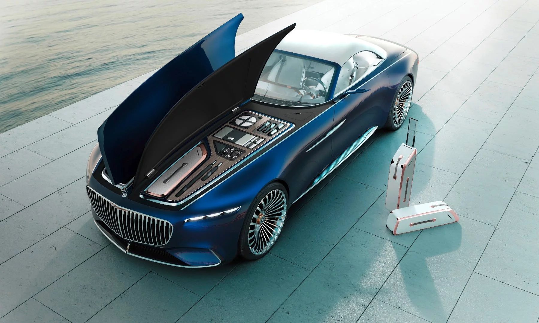 The 6 Cabriolet is an electric concept with four motors, and Mercedes-Maybach uses all that under-hood space to house a luggage set and offer additional cargo space