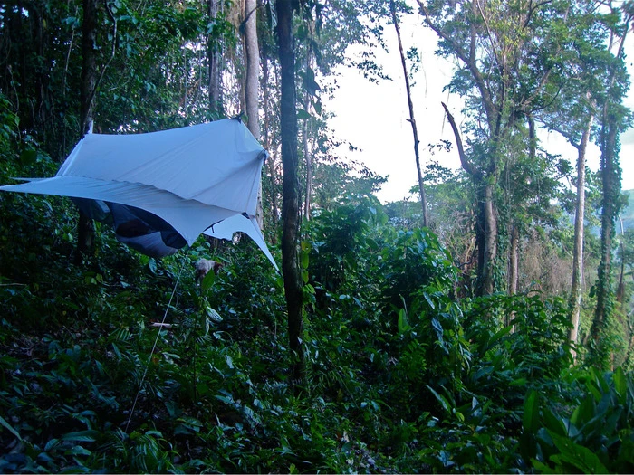 The Nube attaches to any camping hammock to form a completely enclosed shelter that keeps you and your gear off the ground in almost any location