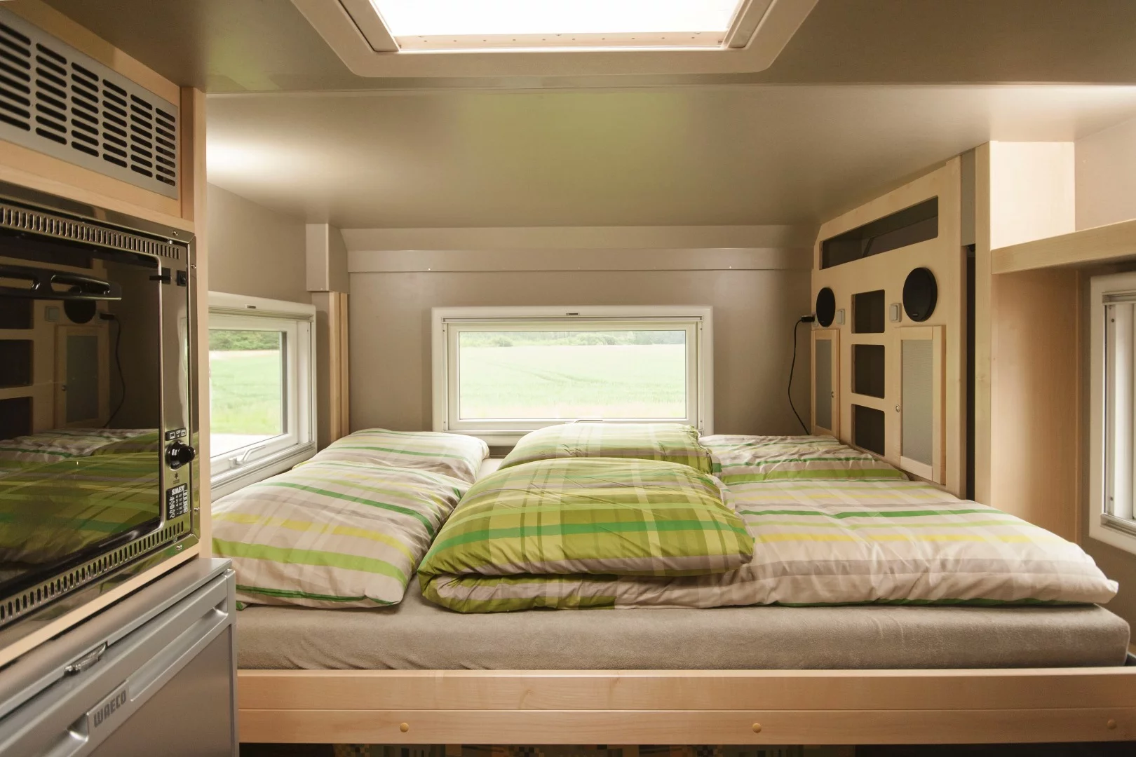 The lifting bed stores above the dinette and drops down when it's needed