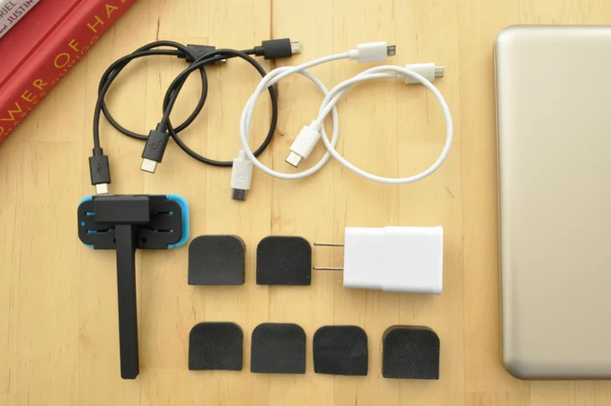 The smartphone adapter lets you attach your phone to the side of the laptop