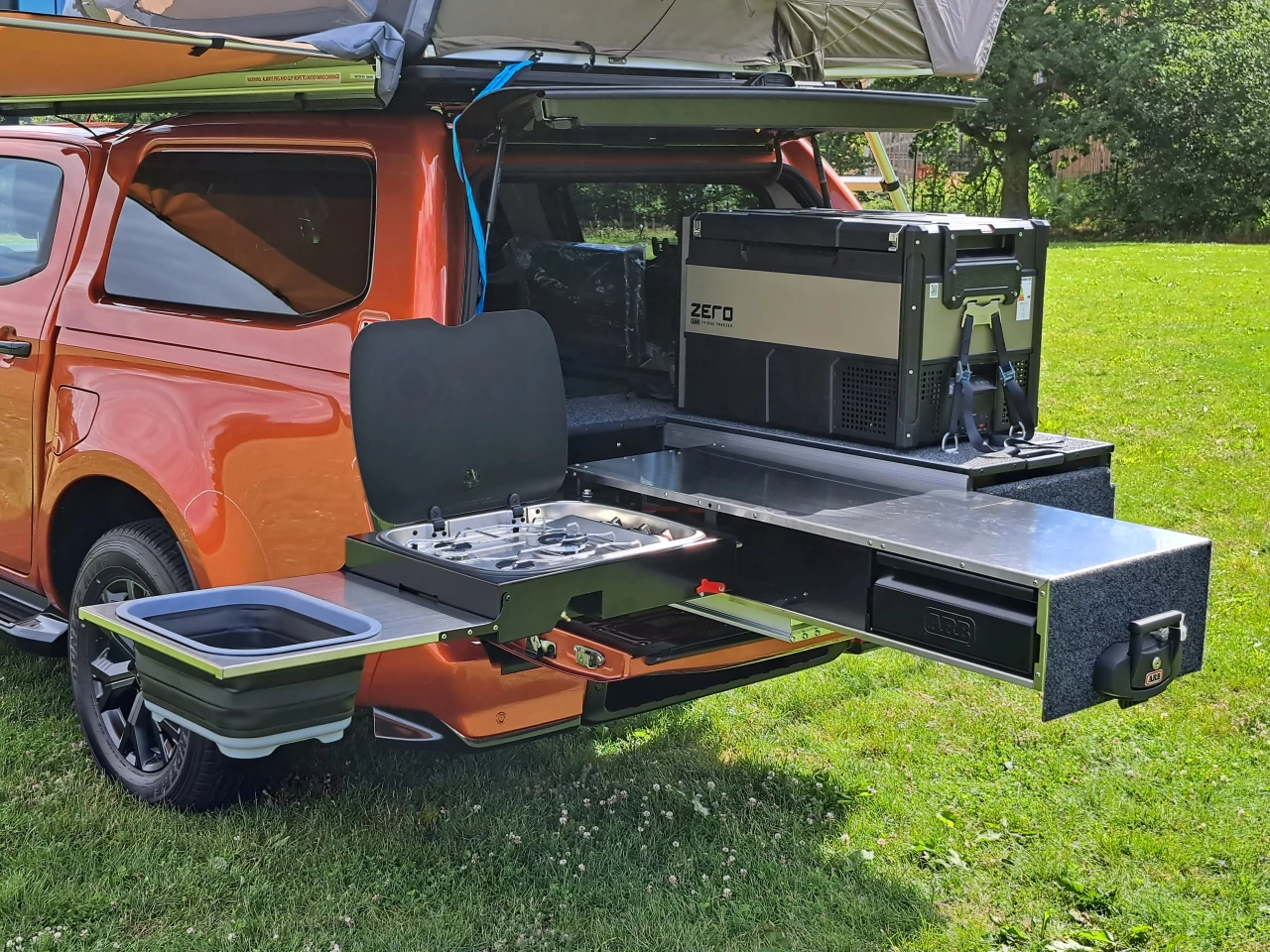More expansive than the average slide-out kitchen, ARB's Slide Kitchen has a separate swing-out arm with triple-burner stove and collapsible sink basin