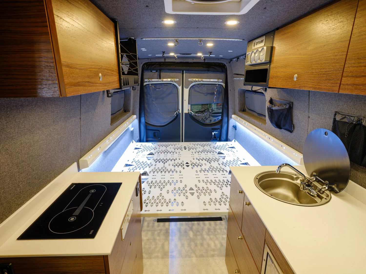 Bed mounted down low right atop the side benches