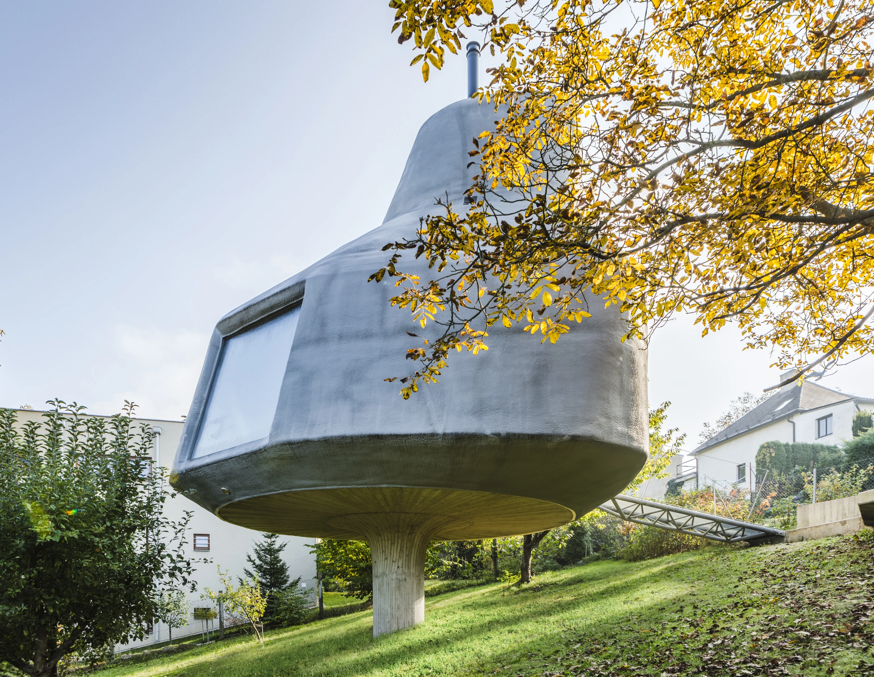 The House in the Orchard sits on a single concrete stilt