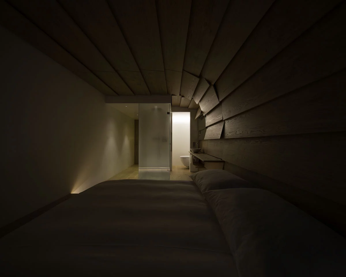 The Therme Vals project in Switzerland, by Kengo Kuma & Associates, is a set of apartments renovated to house hotel staff, with the designers aiming to create space filled with "warmth and intimacy"