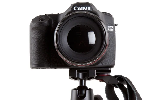 The Joby UltraPlate can be used with a both a tripod plate and a shoulder strap at the same time
