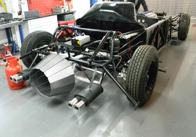 No jet engine here, but the replica does have a fuel injected Jaguar 3.2 liter engine, remote ignition, hydraulic suspension, smoke release mechanism, flame thrower