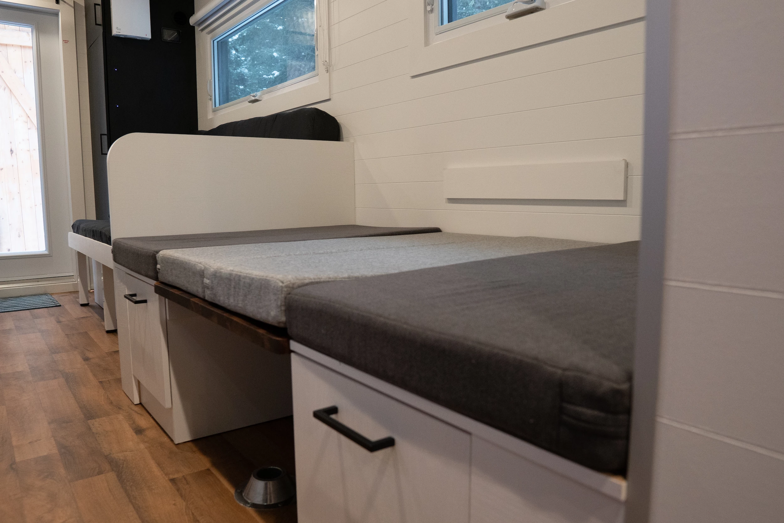 The Nomad 5th Wheel's dining area can be converted into a bed that sleeps one