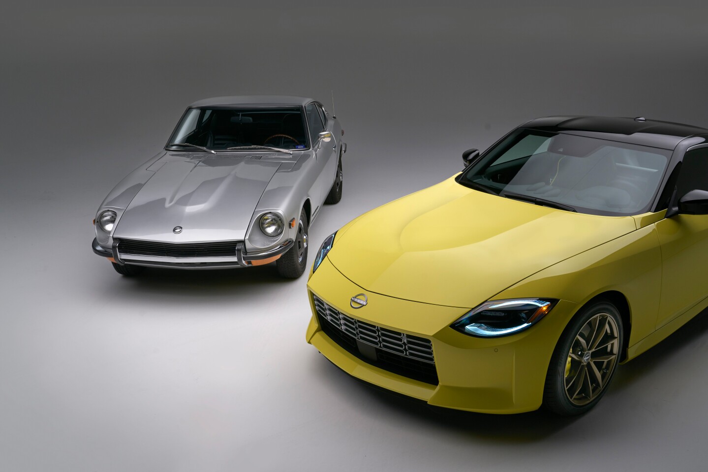 The new Nissan Z (right) pays buckets of design homage to its predcessors