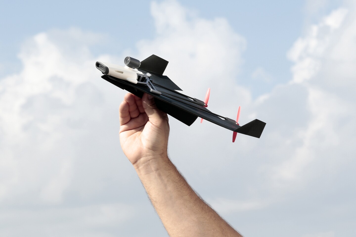 The PowerUp FPV consists of a front-located electronics module, a nylon/carbon fiber frame, and two props in the rear, all of which are attached to the top surface of a user-folded paper plane