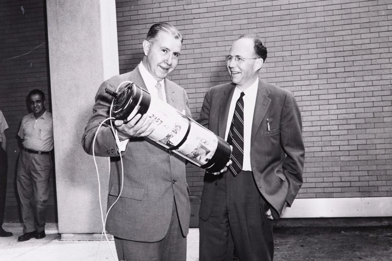 President James R. Killian Jr (left) and professor of electrical engineering Harold “Doc” Edgerton burying the time capsule