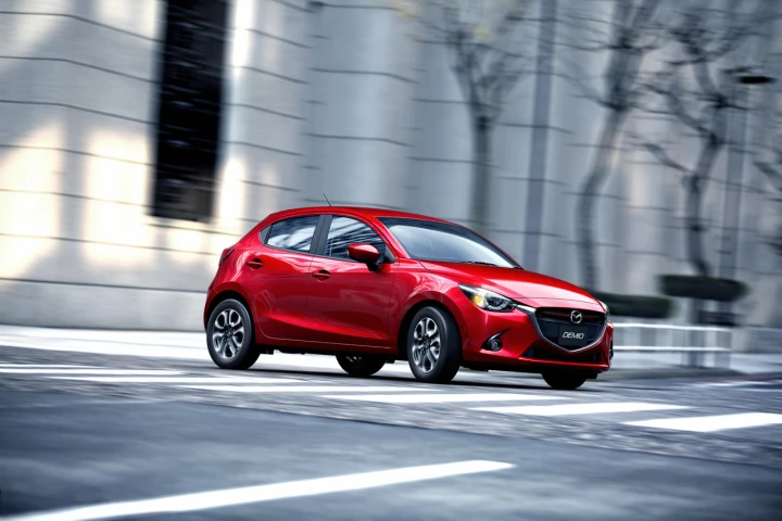 The 2016 Mazda 2 now shares the oversized grille work, angular headlights and sloping nose treatment of its larger siblings