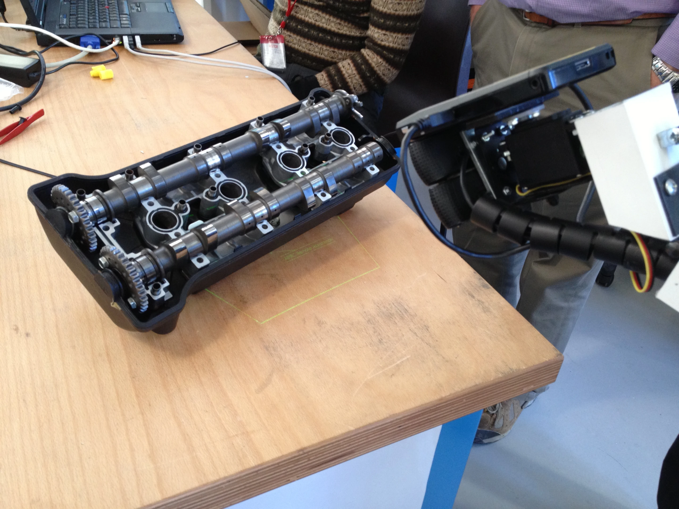 The IBM MRO prototype provides laser projection of information onto the work surface being used by the field engineer (Photo: IBM)