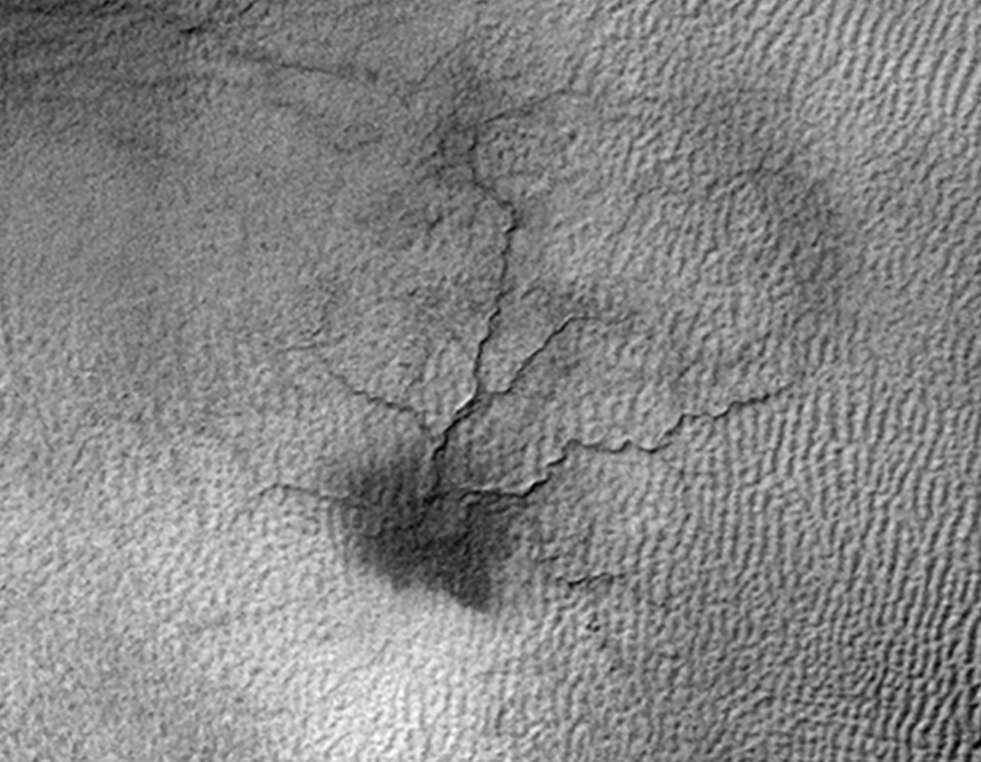 A spider-like surface feature on Mars that scientists believe is caused by thawing carbon dioxide ice