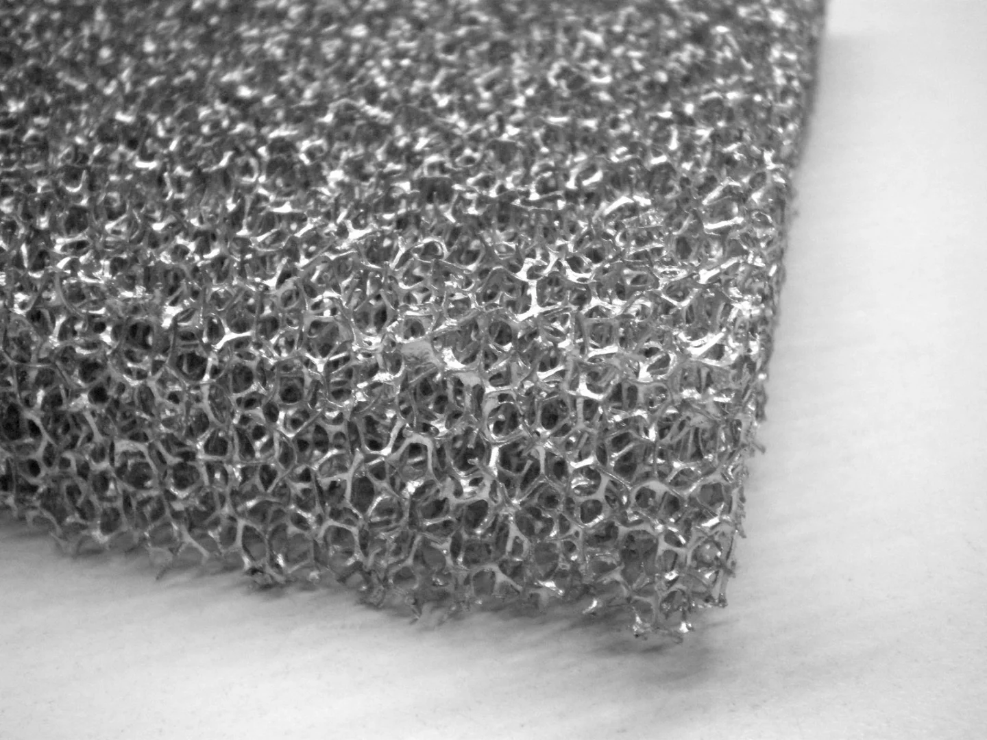 A close-up view of one of the metal sponges, which gets coated in wood fibers