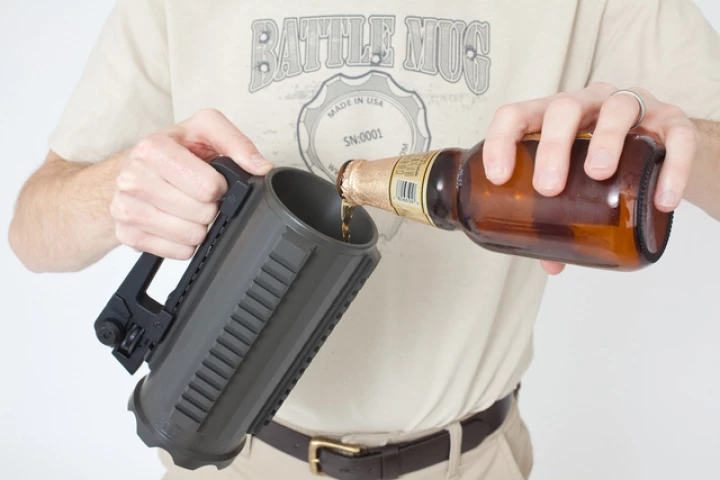 The Battle Mug is made from a solid block of aluminum, features a handle from an AR-15 rifle, and has mounting rails for accessories such as night-vision scopes