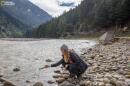 Lead author of the study Emily Duncan releases a tagged bottle into the Ganges river