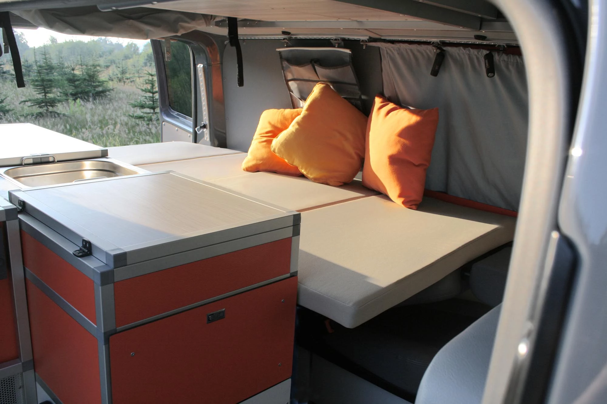 The traditional Terock floor plan puts a kitchen on the passenger side and a single rear seat/folding single-berth bed on the other