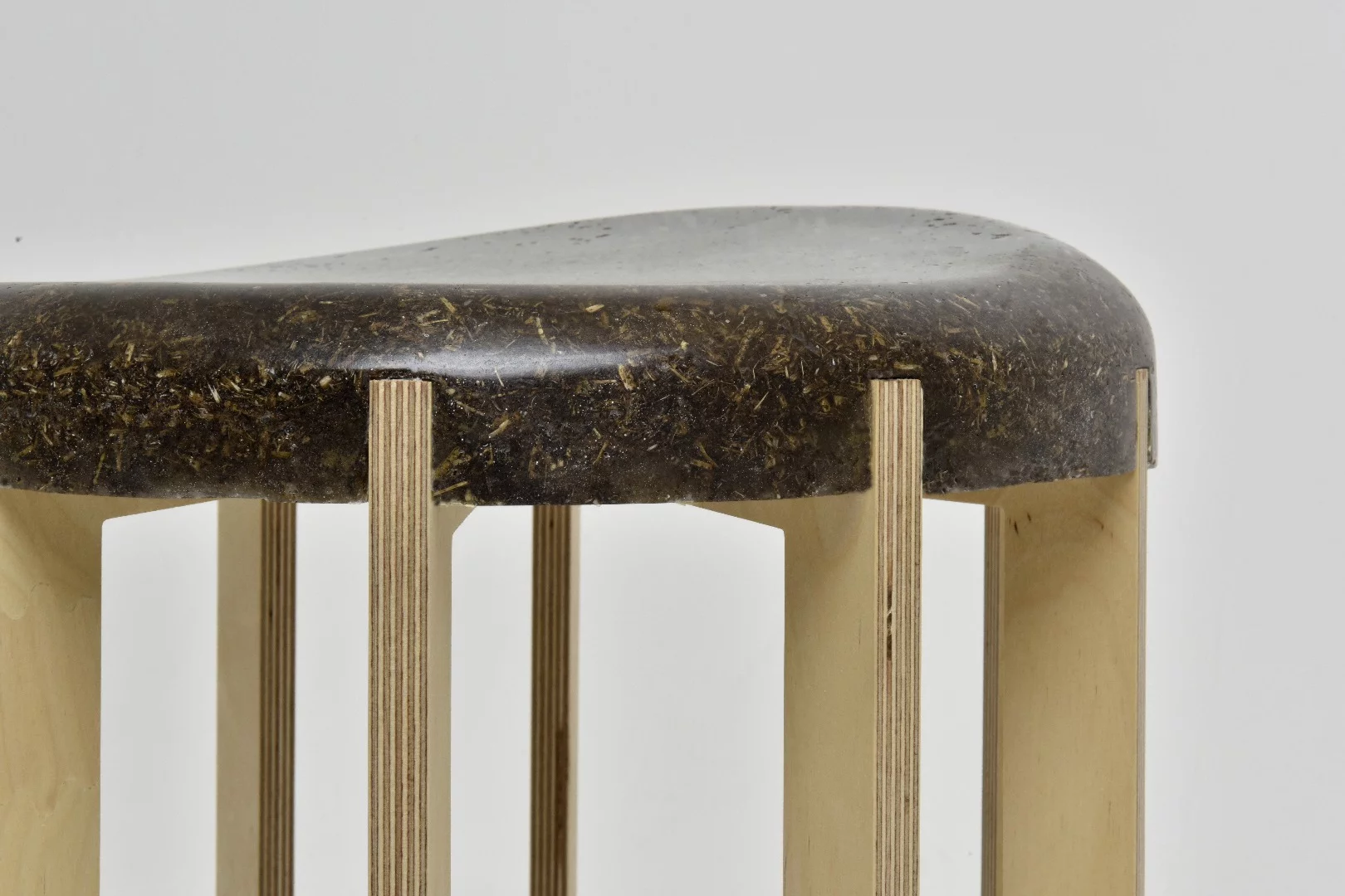 The manure/binder mix retains the "detail of the material" for this stool made of stool