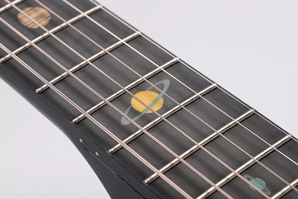 Fret markers on the fretboard represent each of the planets in our solar system