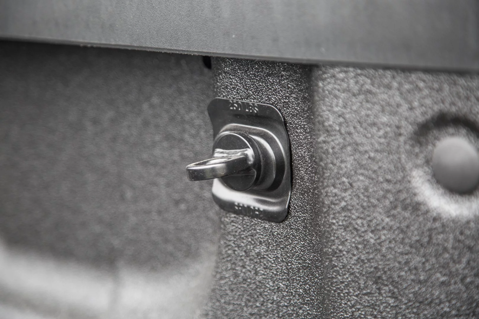 The bed on the Silverado is full of tie-down hooks and practical touches