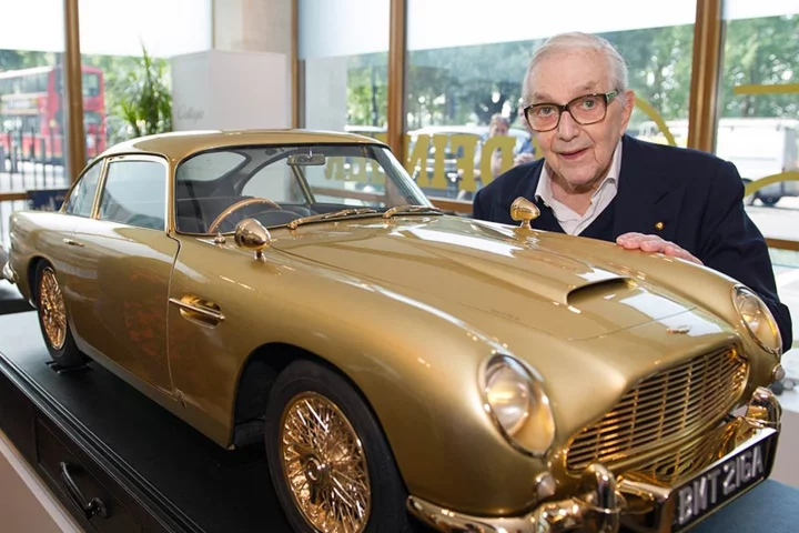 Sir Ken Adam, designer of the "Q Branch" DB5, and the scale replica (Image: Aston Martin)