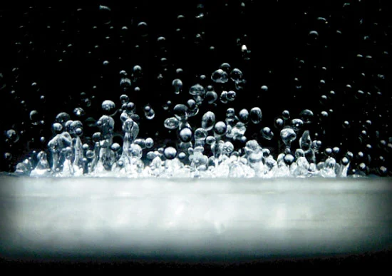 Close up of the dancing liquid within the transparent tube