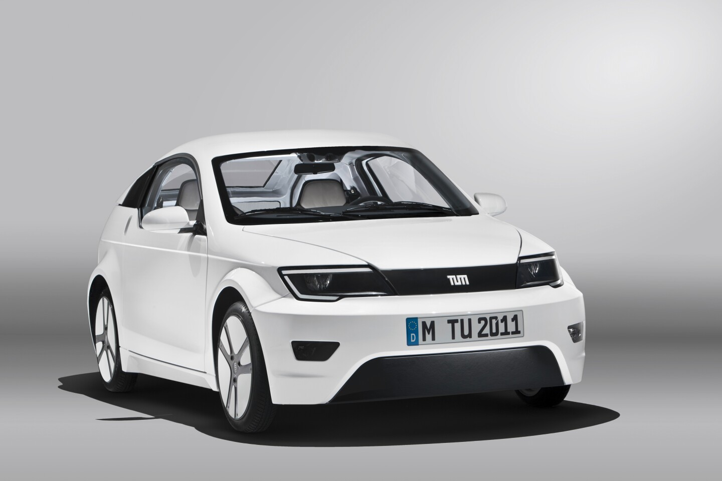The sporty two seater electric coupe features a lightweight aluminum frame and carbon fiber reinforced plastic chassis