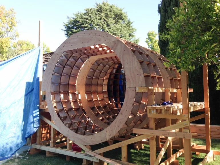 The interior of the Tsunamiball includes bench seating with five point harnesses that fold into beds, a small electric stove, composting toilet, kitchen area, and plenty of storage (Photo: Chris Robinson)