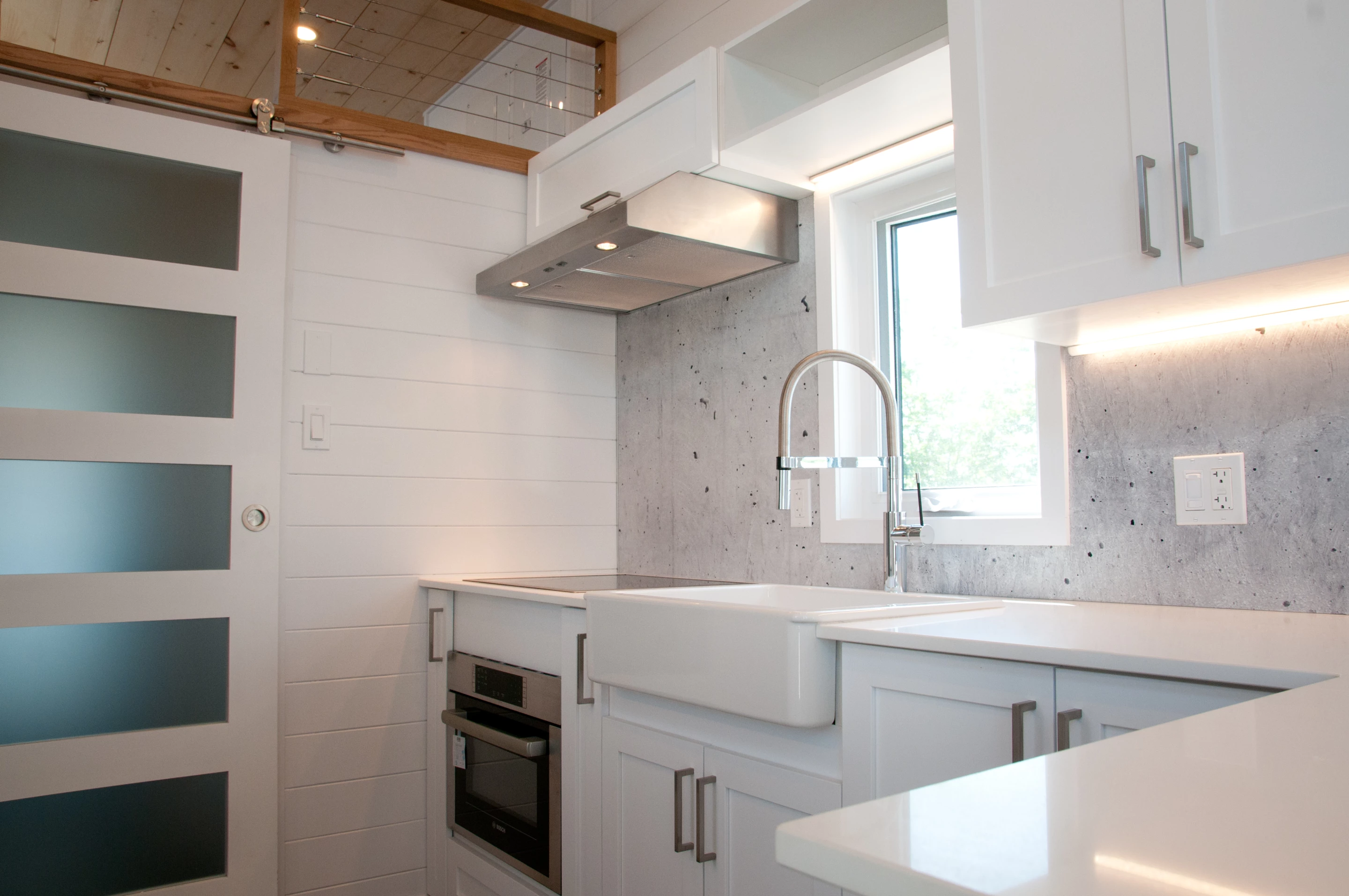 The Magnolia V5's kitchen has generous cabinetry for a tiny house