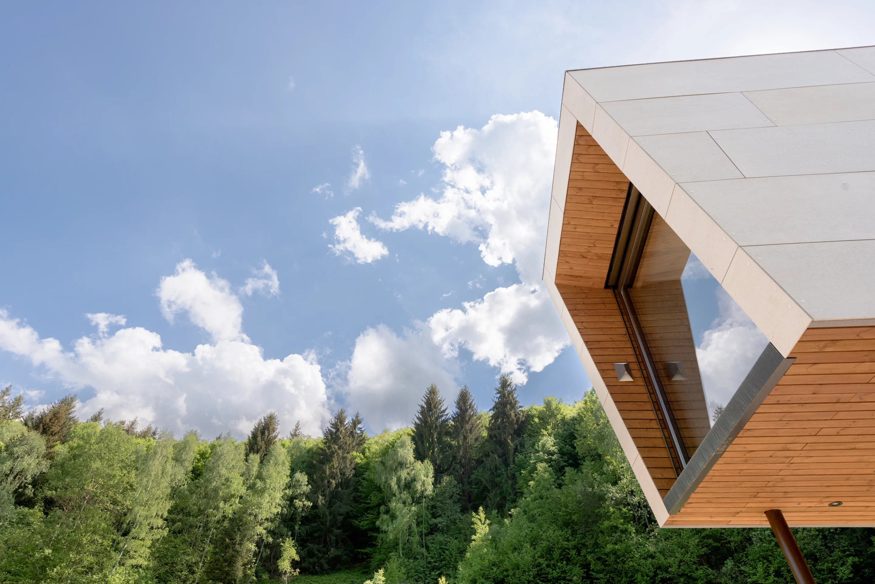 The Cabini Edelweiss is finished in fiber cement panels, with wooden detailing