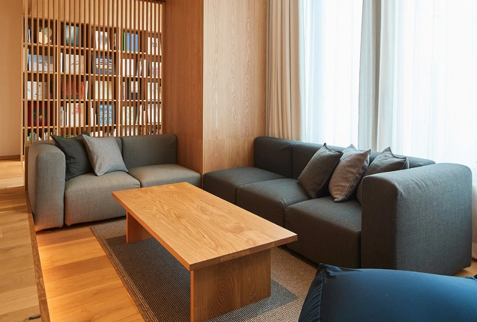 Gorgeous lounge is seperated by a wooden library in the Type I suite