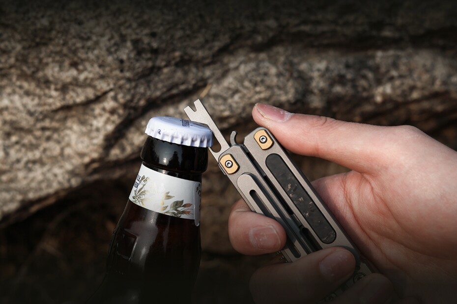 The small pry bar / nail puller / bottle opener, which looks like it could be a bit too bendy for heavy-duty prying or nail-pulling