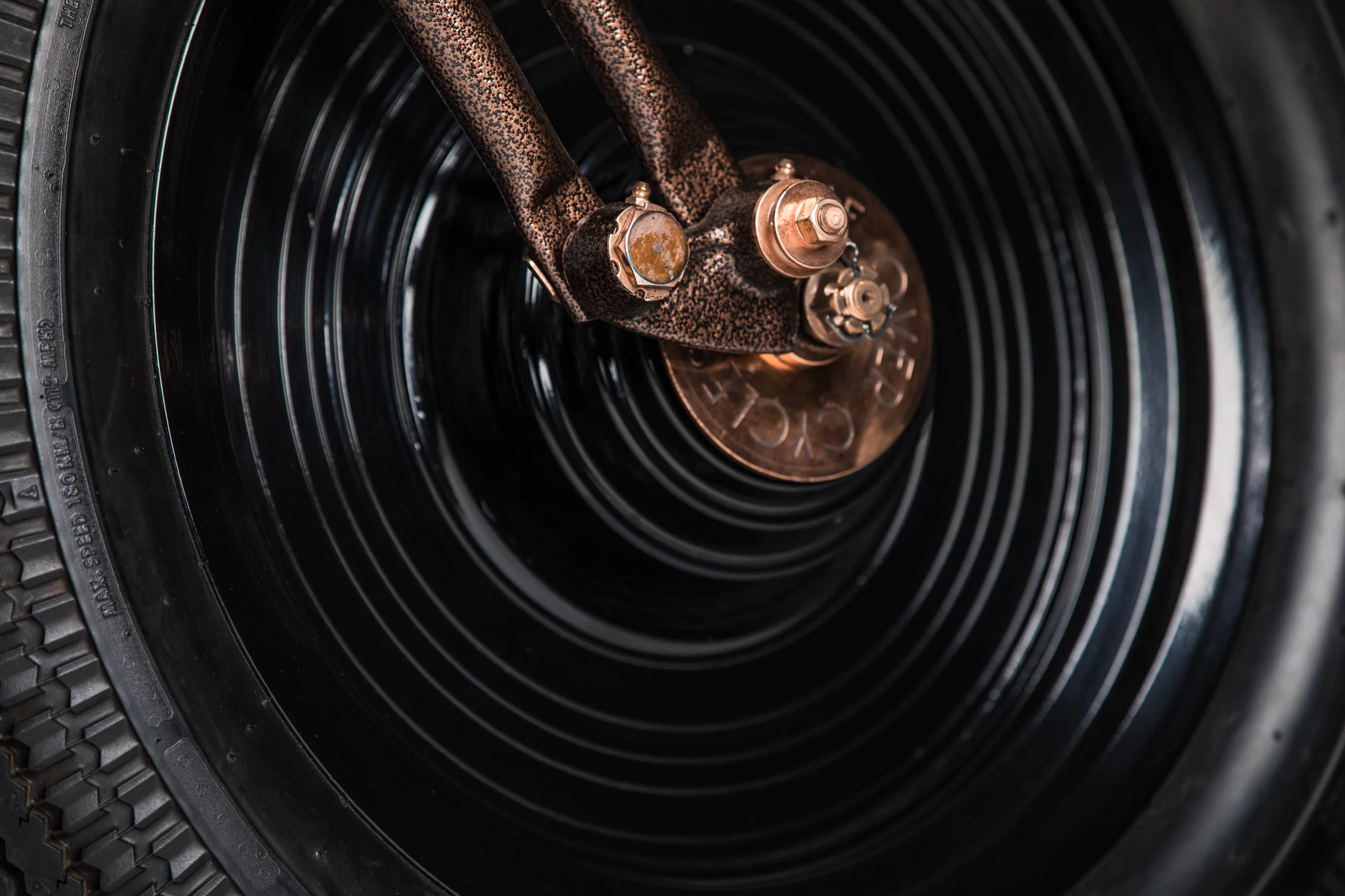 The Fat Boy wheels of the Cafe Racer by Game Over Cycles have been blackened out and etched with grooves to look like a vinyl record