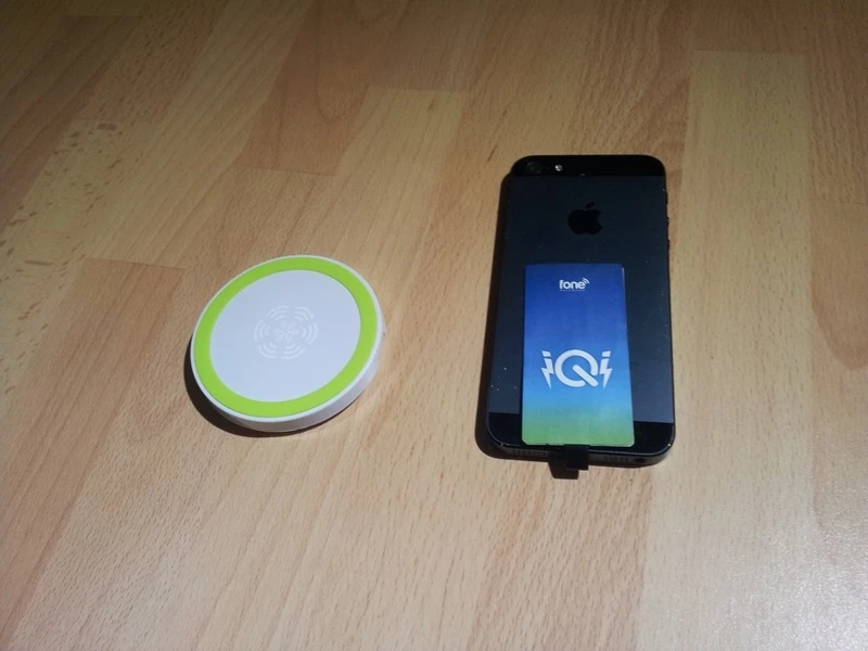 The patch is folded behind the iPhone