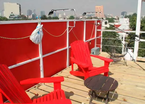 The roof has a wooden terrace that gives residents an outdoor area for relaxing