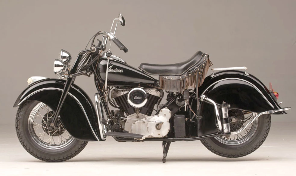Steve McQueen's 1946 Indian Chief. In the book “McQueen’s Machines: The Cars and Bikes of a Hollywood Icon” by Matt Stone, McQueen biographer William Nolan conveys that in the fall of 1951, McQueen had “saved enough money to buy a battered cycle with a sidecar, which he proudly tooled around the (Greenwich) Village. ‘It was my first bike and I loved it,’ admitted Steve. ‘But I was going with a girl who began to hate the cycle – just hated riding in the bumpy sidecar. She told me, “Either the cycle goes or I go!” ‘Well, there was no contest. She went.’” That battered cycle was this 1946 Indian Chief, with the sidecar removed..