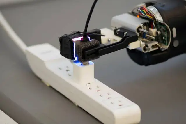 Using a GelSight sensor on one of its pinchers, a Baxter robot is able to guide a USB plug into a socket