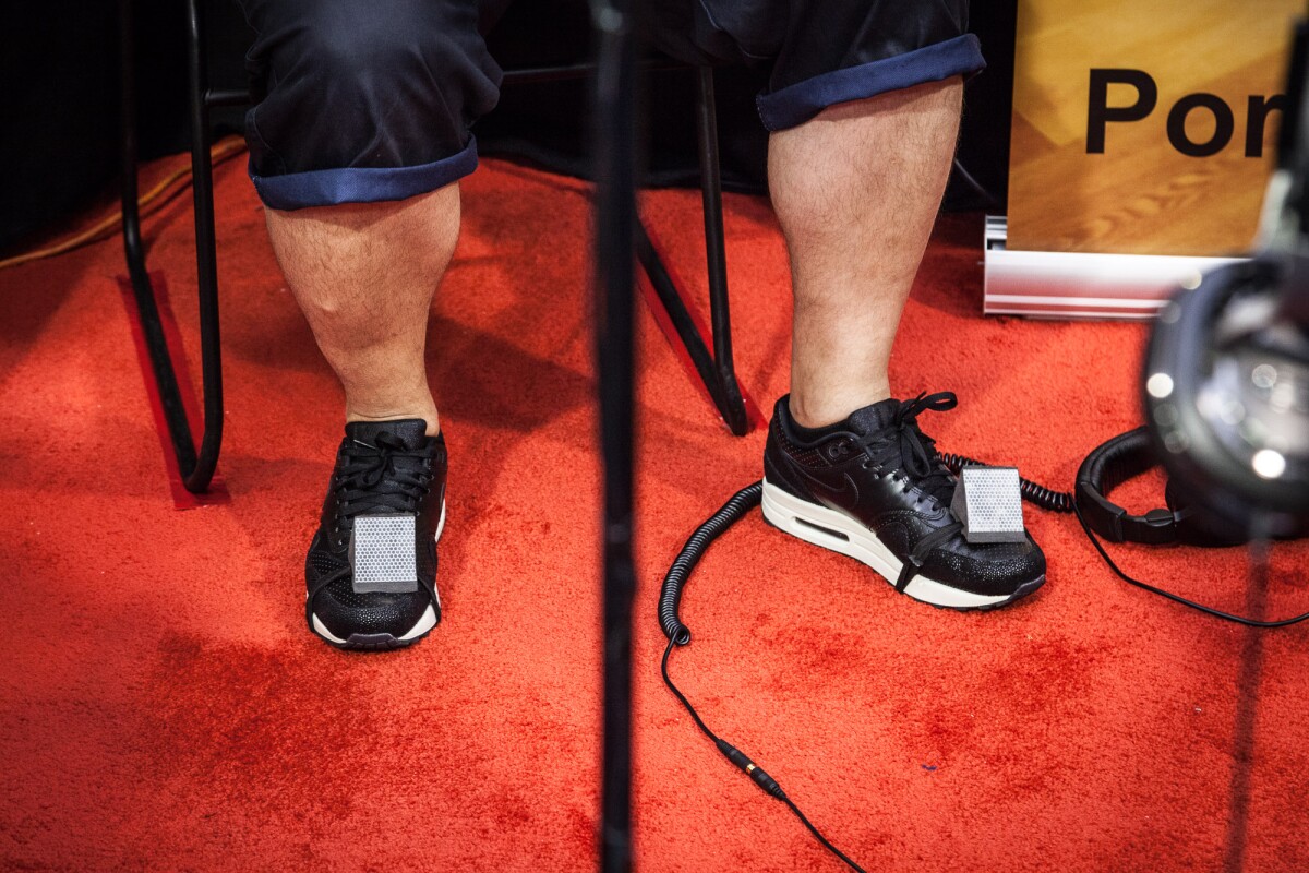 Reflective pads strapped to your shoes track your footwork (Photo: Gizmag.com/Loz Blain)
