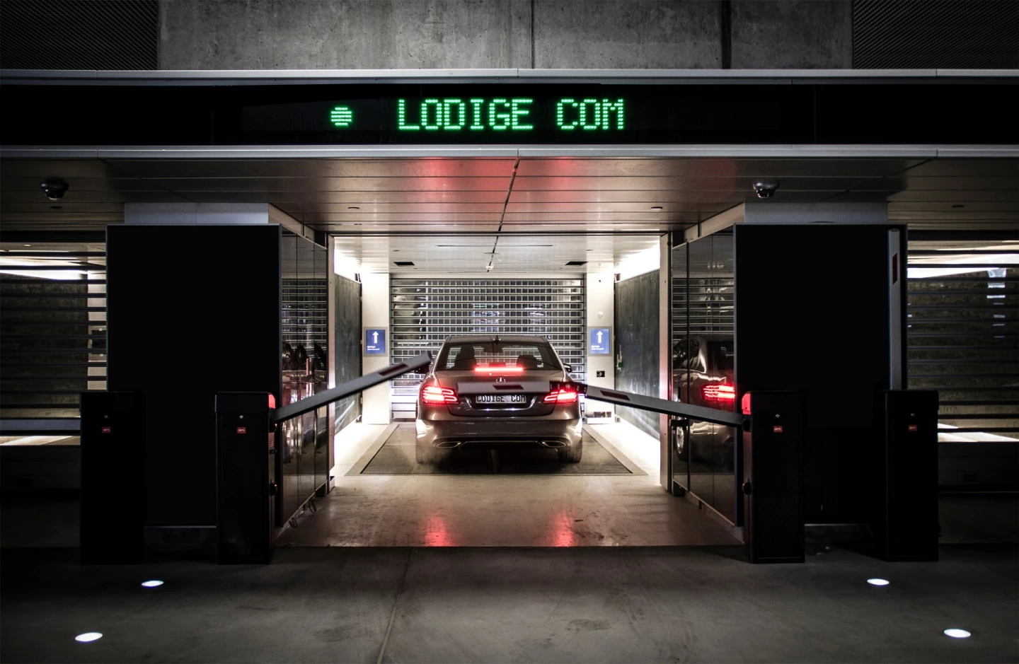 Drivers park their car at ground level in one of 20 booths and receive a ticket, after which their car is robotically transported to a space