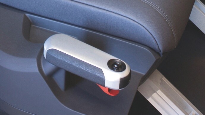 The drive-stick on the right-hand side of the passenger seat .