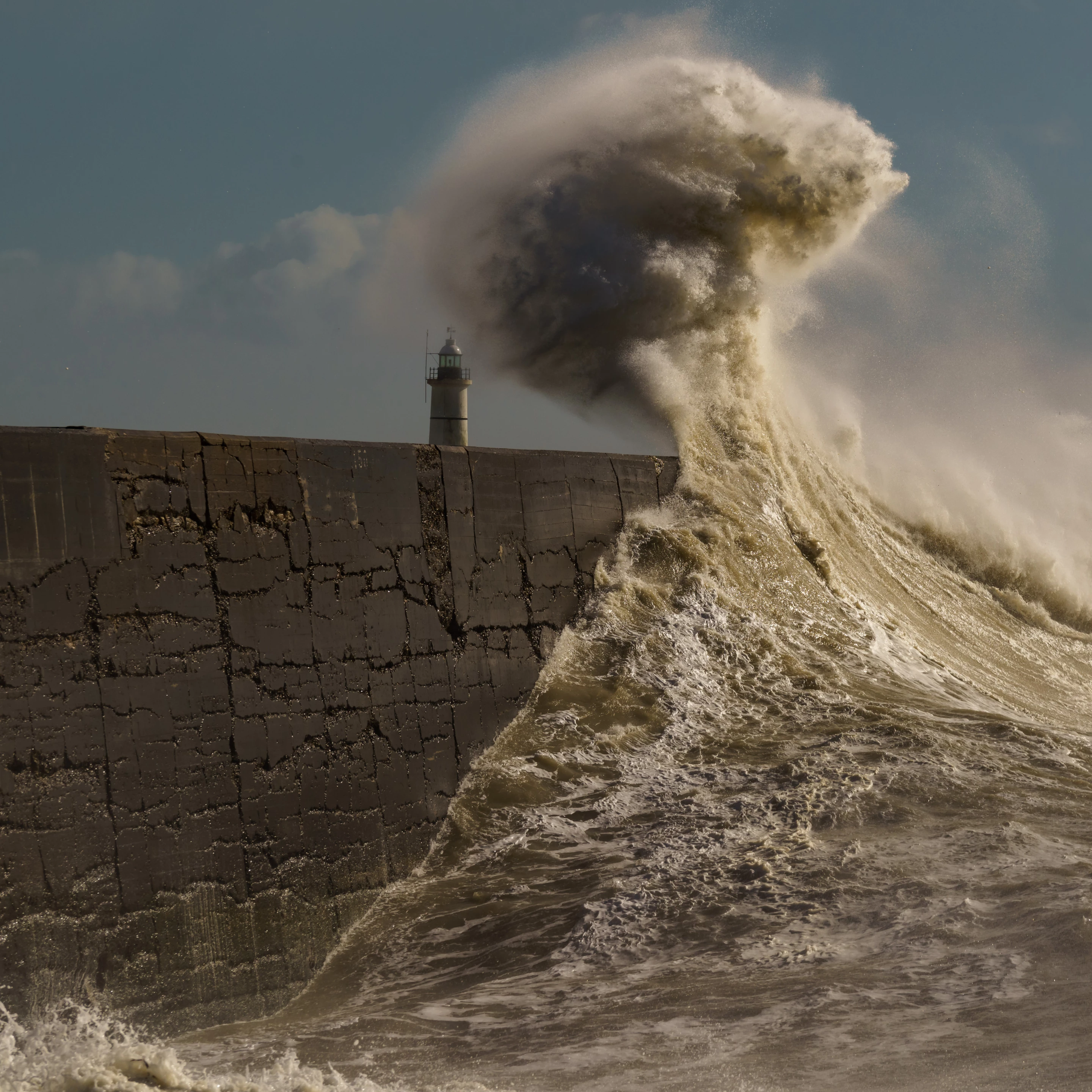 Shortlist, Motion, Under Siege. A large wave scales the harbour wall at Newhaven in East Sussex, UK
