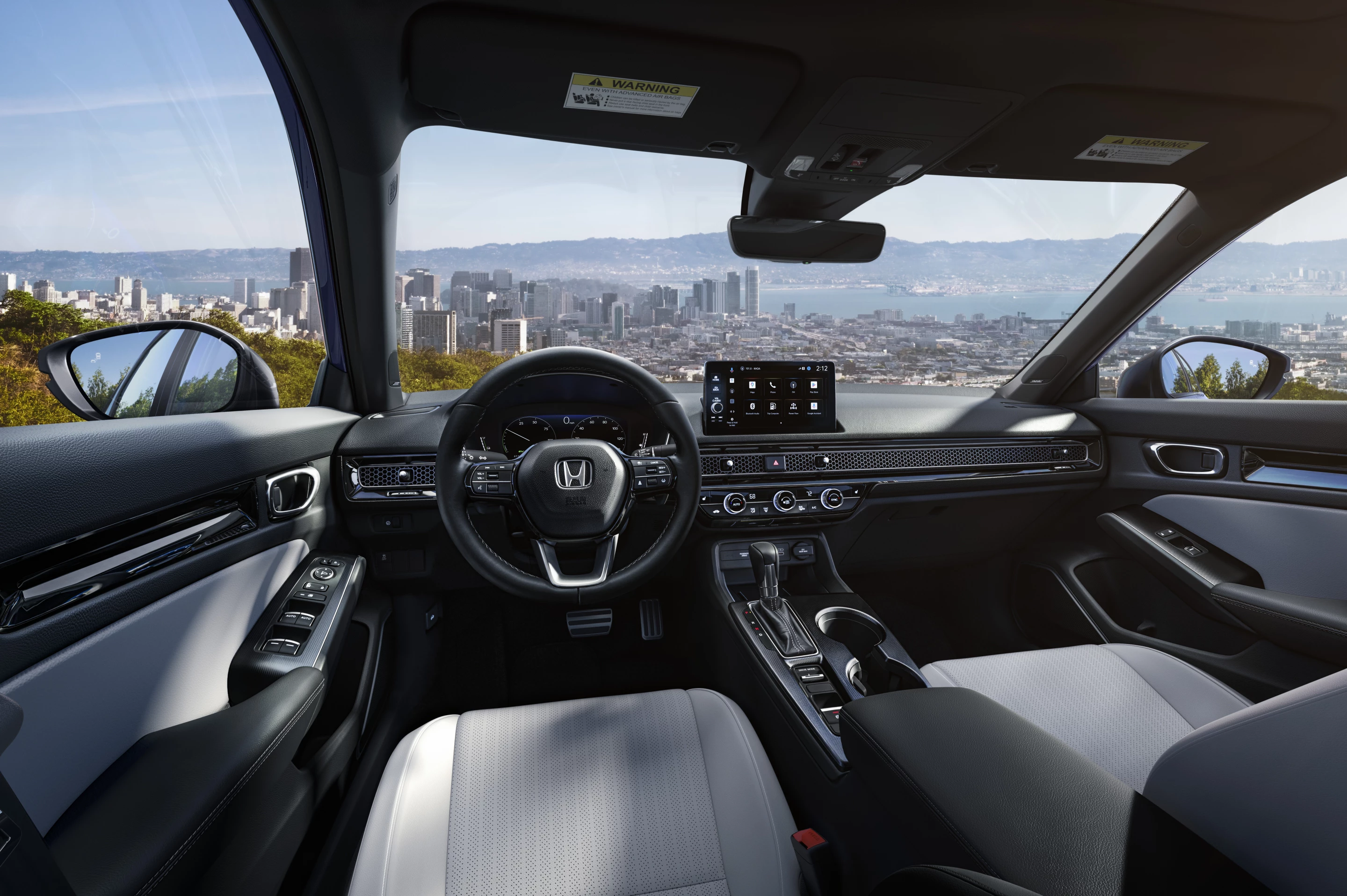 The interior of the 2025 Honda Civic Hybrid is pretty plush for an economy car